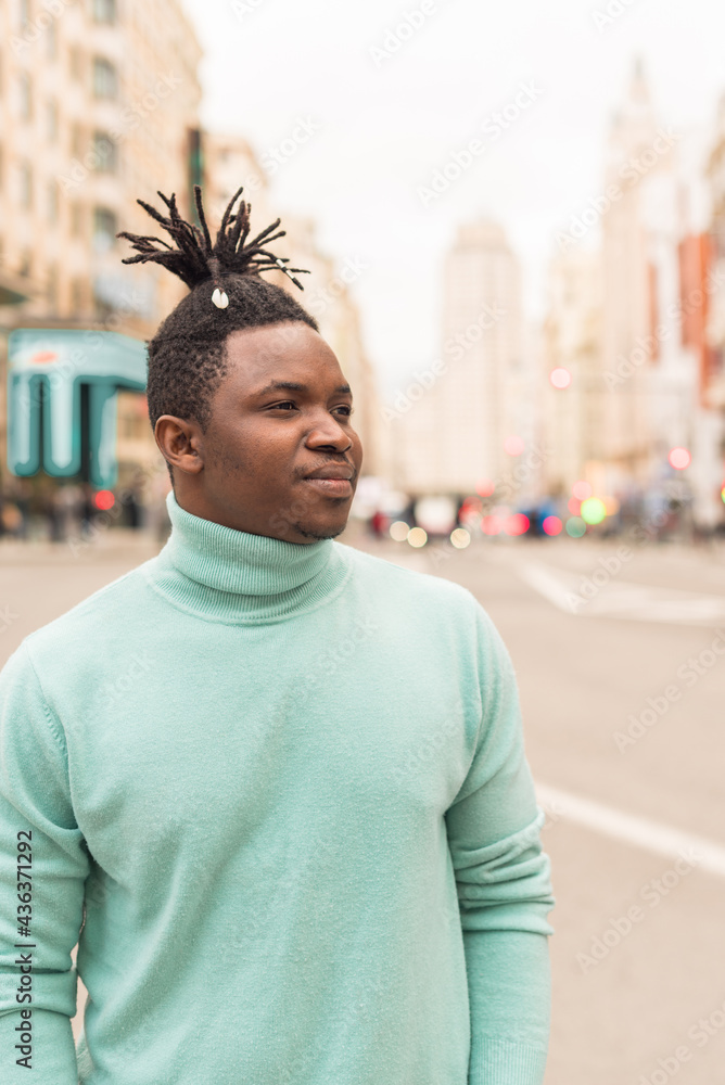 Black boy in the middle of the city, serious. Black boy in the middle of the city, serious.