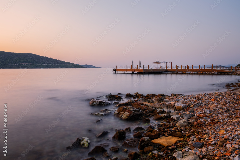 sunset over bay in Aegean sea. Torba, Bodrum, Turkey. October 2020. Long exposure picture