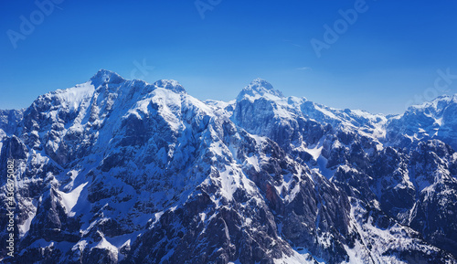 severe view of spring still snowy slovenian alps Mala Mojstrovka