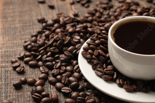 Coffee cup and beans on a rustic background. Espresso.