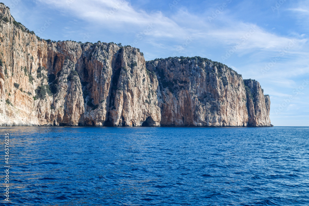 Rock in the sea. Scenic landscape of rocky coastline in Sardinia, Italy. 