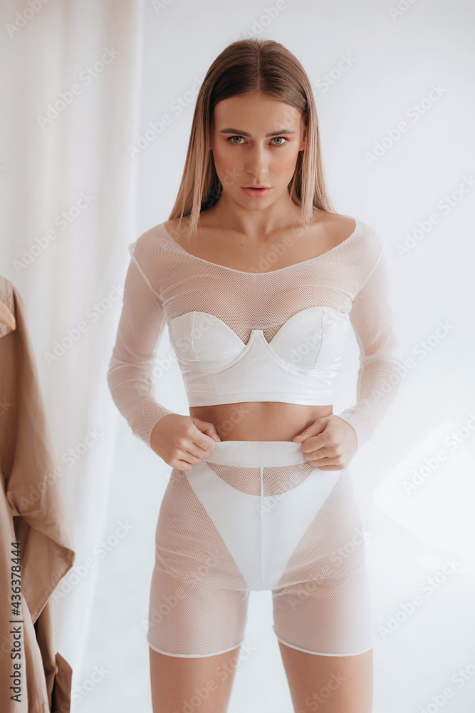 Obraz premium Girl in a fashionable color combination of clothes. Total white. Natural colors. Trend of 2021. Natural female beauty.
