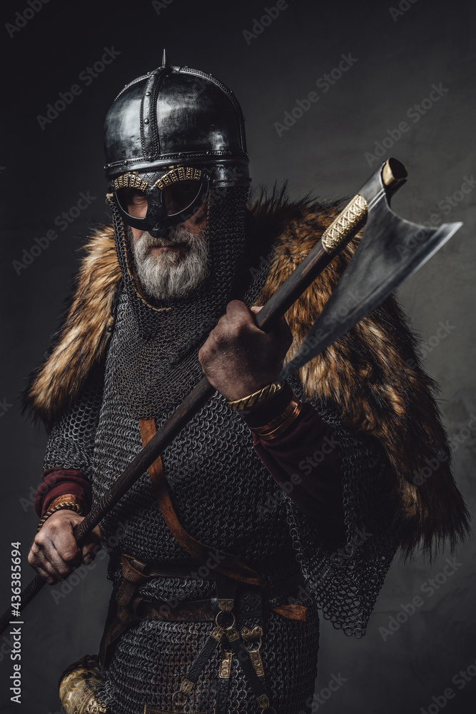 Naklejka premium Studio shot of antique old age viking with axe