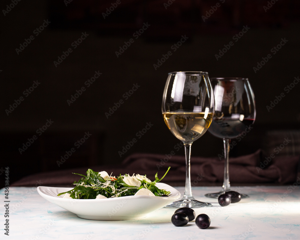 salad with rye and cheese and white wine, olives on the background salad with rye and cheese and white wine, olives on the background