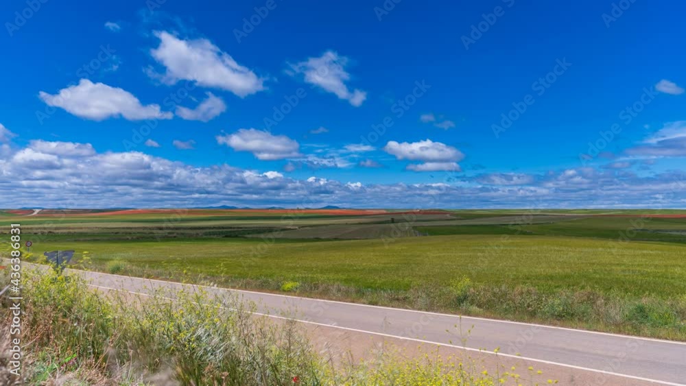 Vast cultivated plots under the cloudy sky time lapse Vast cultivated plots under the cloudy sky time lapse