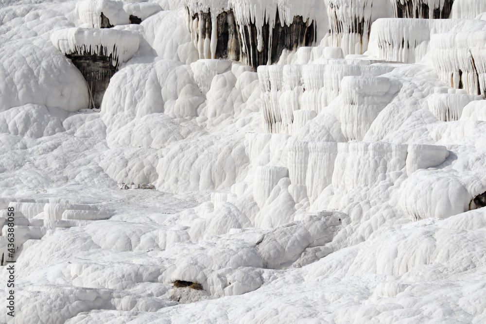 Close up of white limestone natural travertine terraces in pamukkale with pools full of carbonated water Close up of white limestone natural travertine terraces in pamukkale with pools full of carbonated water