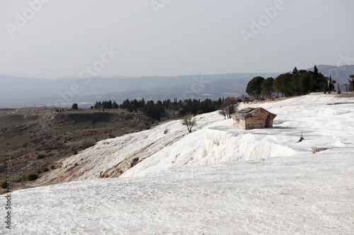 ancient hellenic tomb submerged in travertine pool in Hierapolis  Pamukkale in Turkey scenic view