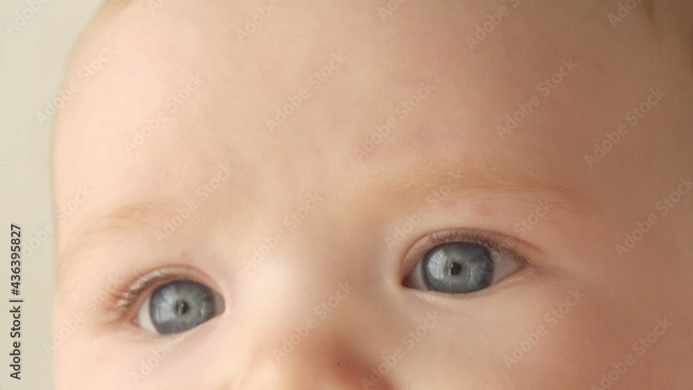 Close-up portrait of a cute little smiling baby. Emotions of a small child. A child with beautiful eyes Close-up portrait of a cute little smiling baby. Emotions of a small child. A child with beautiful eyes