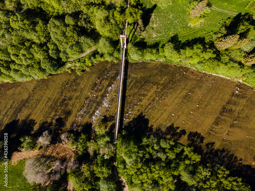 Fototapeta Naklejka Na Ścianę i Meble -  Bridge Over River. Top Down Drone View. Bieszczady Park in Poland