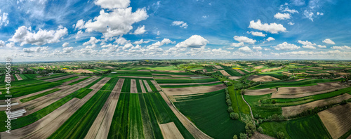 Panoramic View Over Rolling Hills in Coutryside. Spring on Farmland.Drone View
