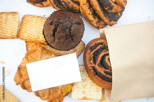 Assorted pasrties with white empty business card photo