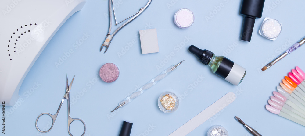 Tools and materials for manicure flat lay with copy space in banner format. Top view manicure background Tools and materials for manicure flat lay with copy space in banner format. Top view manicure background