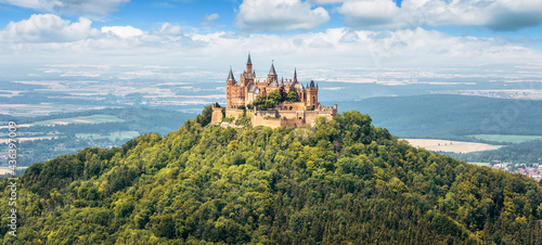 Hohenzollern Castle on mountain top, Germany. Panoramic view of German burg like palace. photo