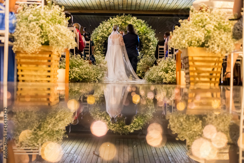 groom and bride from the back at the wedding ceremony