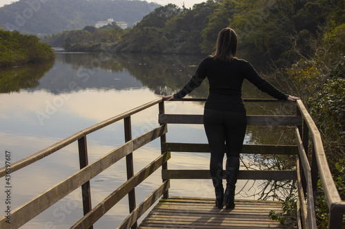woman looking at a lake