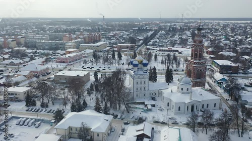 Aerial view of snow covered Bronnitsy townscape with architectural ensemble of Orthodox Archangel Michael Cathedral in winter, Moscow Oblast, Russia