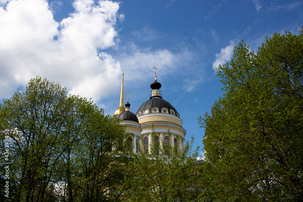 Domes with crosses of the Orthodox church on the background of a blue sky with white clouds. Christian Church, a concept of faith