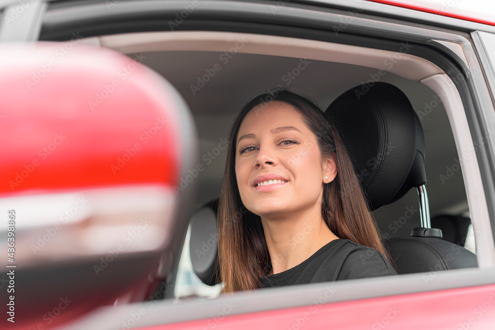 Beautiful young woman driving a car. Attractive brunette in the car. Beautiful young woman driving a car. Attractive brunette in the car.