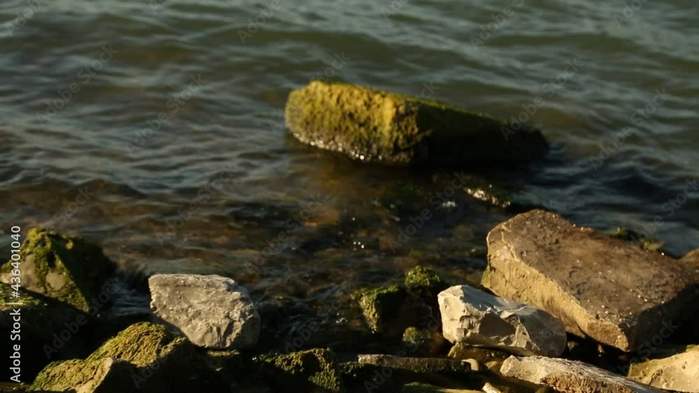 the waves of the sea beat against the big rocks the waves of the sea beat against the big rocks