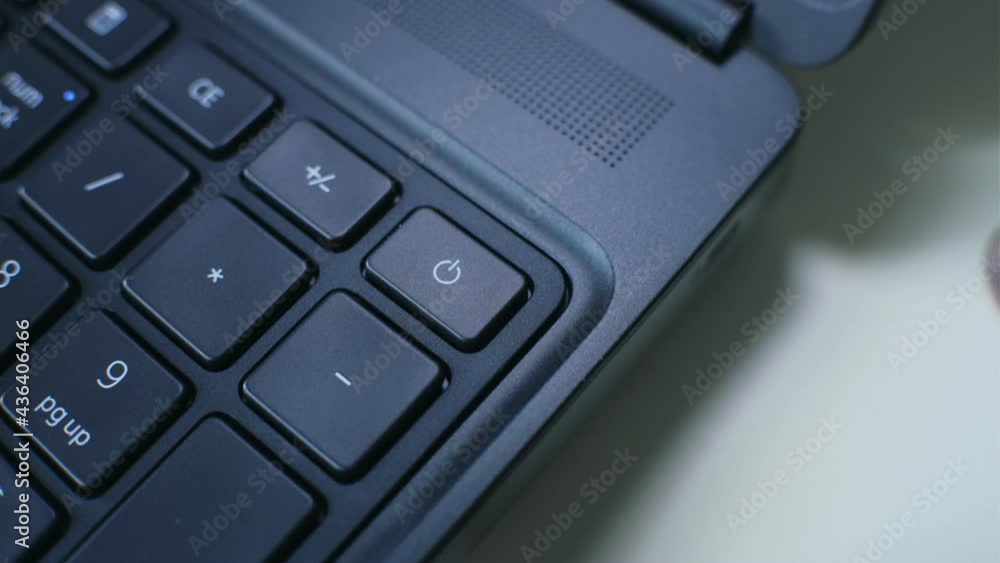 Pressing Computer Laptop Power Button on Keyboard