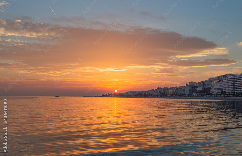 Sunset on the beach of the village of Villajollosa in the province of Alicante, Spain