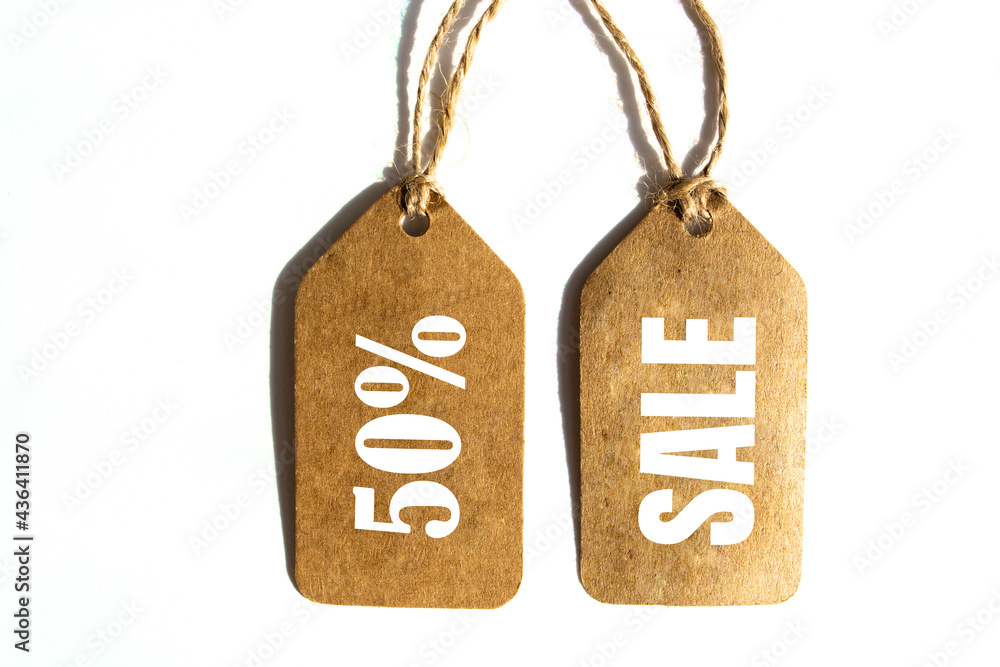 Big Sale 50% off price tag with brown string on white background