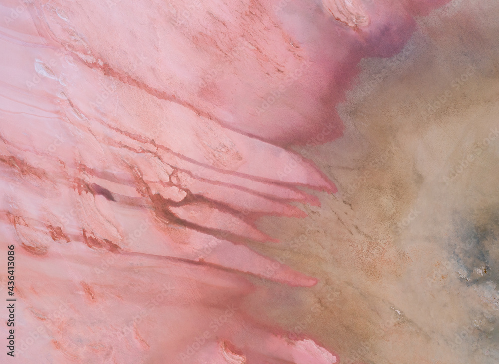 Aerial view of structures at Hutt Lagoon or Pink Lake near Port Gregory in Western Australia, Pink color created naturally by bacteria and harvested in ponds for beta-carotene