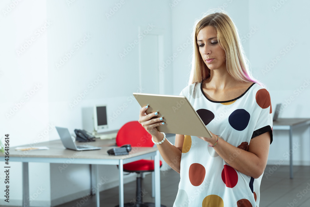 Modern business executive working on a handheld tablet pc Modern business executive working on a handheld tablet pc