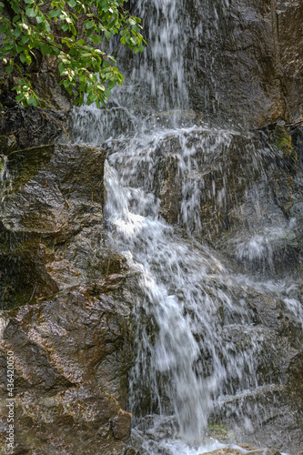 Small waterfall in the city amusement park close-up