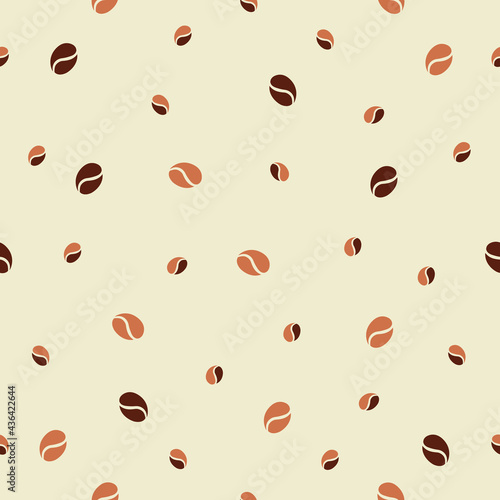 Simple laconic seamless pattern with cute scattered brown coffee beans on a warm light-yellow ivory background