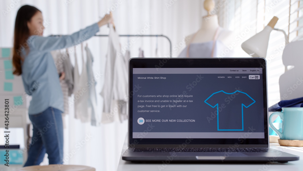 UX UI smart website notebook screen on desk table home office designer studio e-commerce salepage media startup sme with asia busy woman female worker work supply chain logistic delivery wifi network.