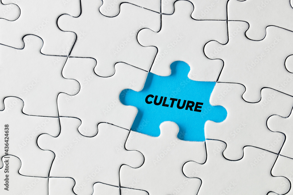 The word culture written on blue missing puzzle piece. Cultural island The word culture written on blue missing puzzle piece. Cultural island