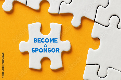 Become a sponsor message on a puzzle piece apart form the assembled pieces. Financial sponsorship support or charity donation photo