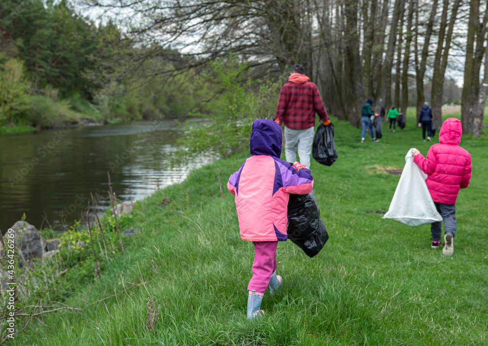 A group of volunteers are cleaning the environment in the forest. A group of volunteers are cleaning the environment in the forest.