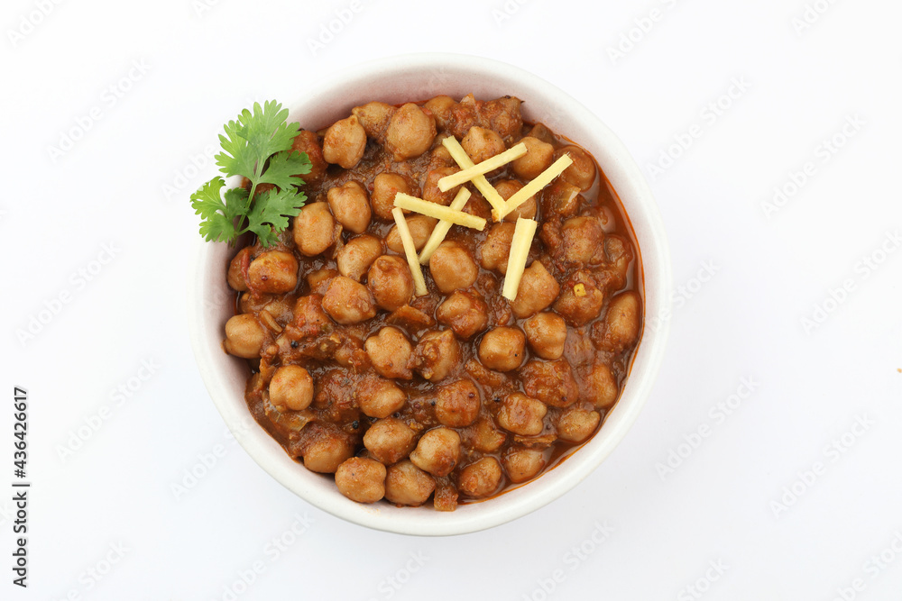 Obraz premium Pindi Chole Kulche or road side choley Kulcha popular in India and pakistan is a popular street food. It's a spicy Chickpea or chana curry served with Indian Flat Bread. Chole masala 