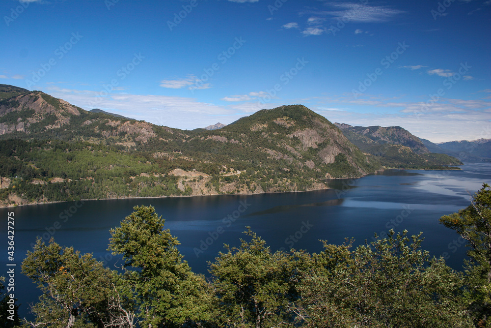 Beautiful landscape formed of forest, mountains and a lake on a beautiful day of alone and colorful foliage. San Martín de los Andes, Argentina landscape.	