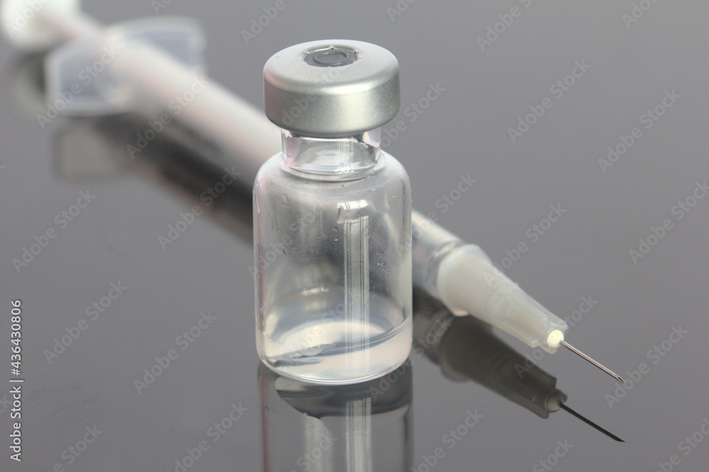 Vaccine vial with needle and syringe Vaccine vial with needle and syringe
