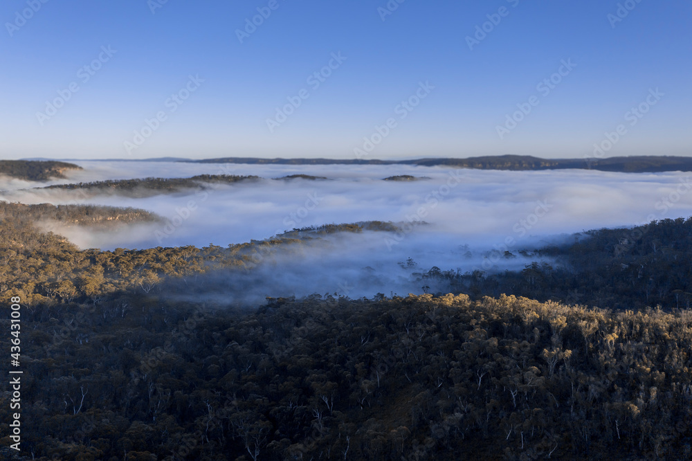 Drone aerial photograph of fog in a large valley in regional Australia