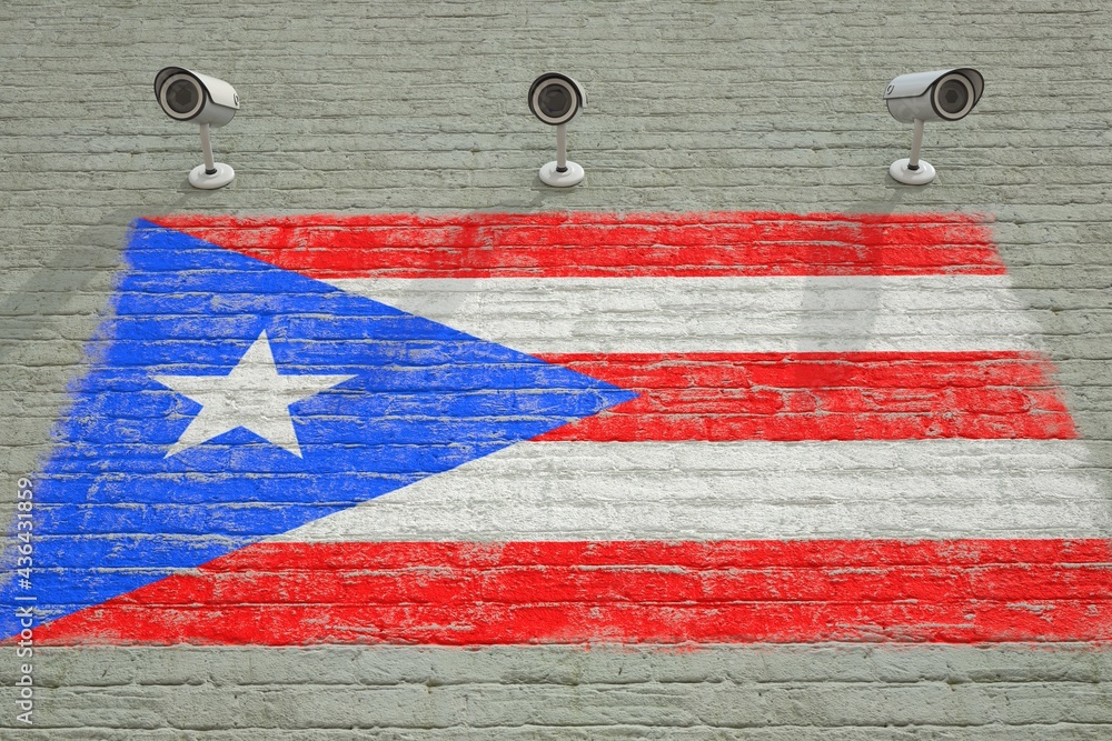 Brick wall with printed national flag of Puerto Rico and CCTV cameras ...