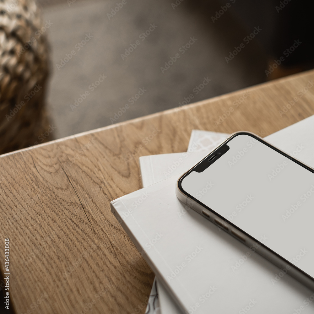 Blank screen mobile phone, paper sheets on wooden table and carpet. Home office desk workspace. Lady, girl boss aesthetic business, work template with mockup copy space. Blank screen mobile phone, paper sheets on wooden table and carpet. Home office desk workspace. Lady, girl boss aesthetic business, work template with mockup copy space.