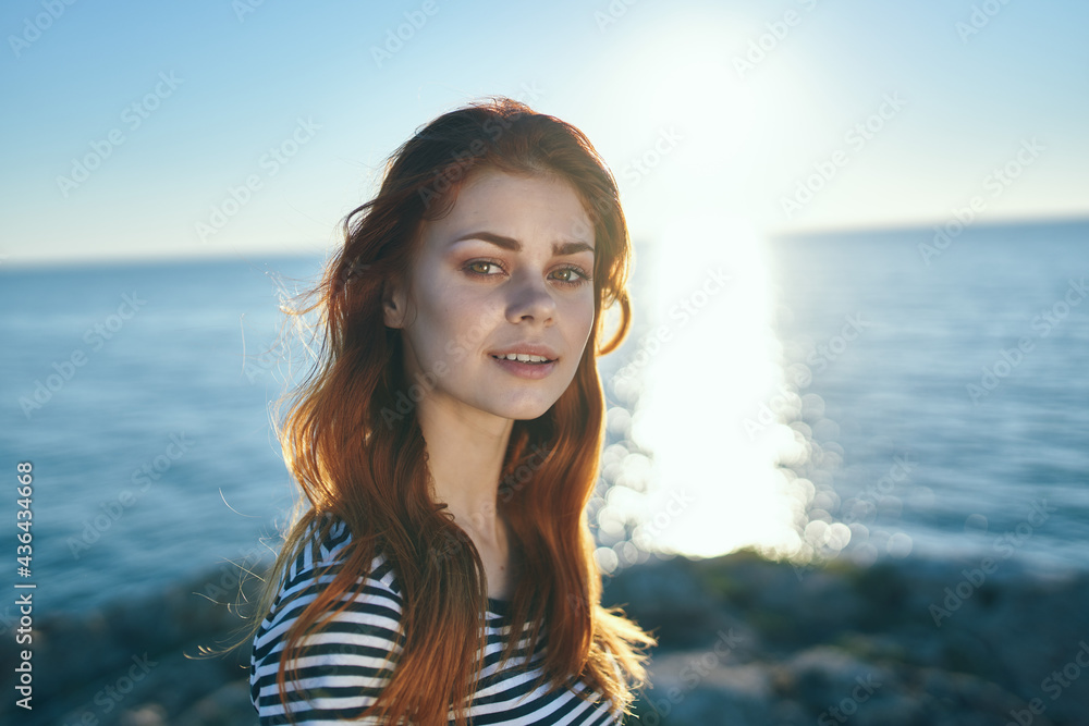 beautiful woman t-shirt in summer on nature in the mountains near the sea sun beautiful woman t-shirt in summer on nature in the mountains near the sea sun