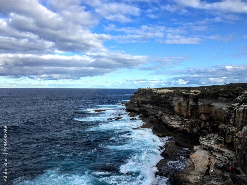 cliffs with slightly cloudy sky