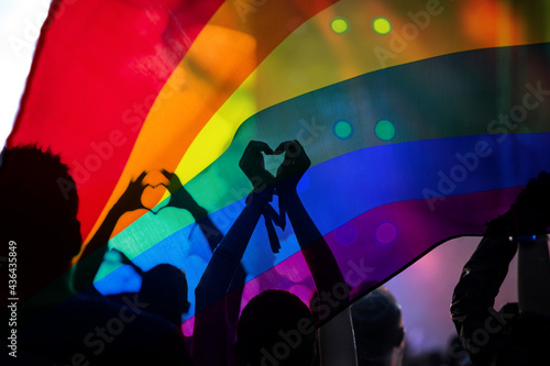 Фотография Gay parade with LGBT flag.