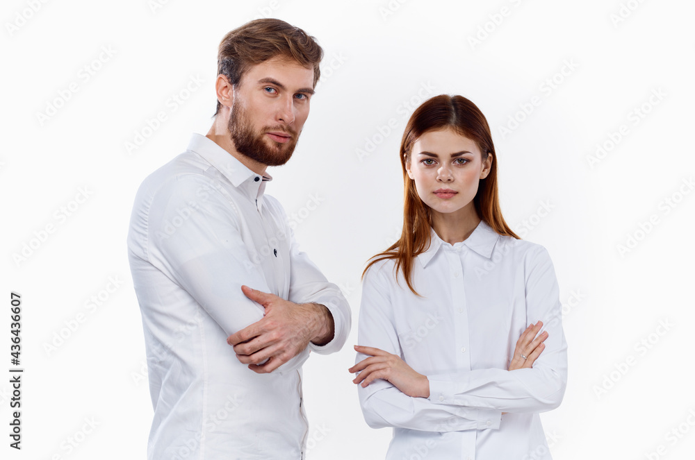 fashionable men and women in the same shirts on a light background communication friends fashionable men and women in the same shirts on a light background communication friends