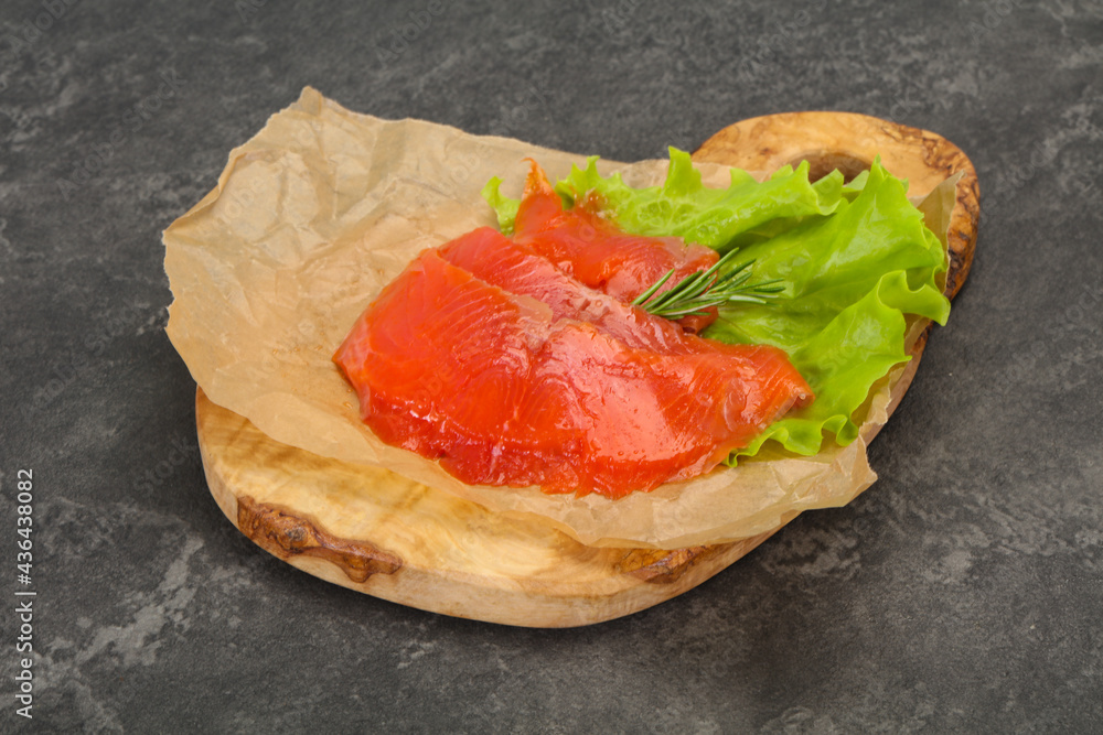 Sliced salmon fillet served rosemary Sliced salmon fillet served rosemary