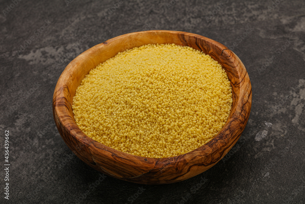 Raw cous cous heap in the bowl Raw cous cous heap in the bowl