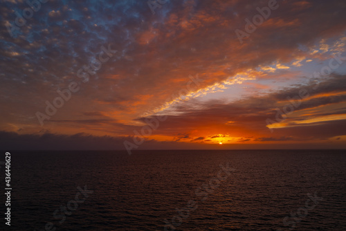Seascape golden sunrise over the sea. Nature landscape. Beautiful orange and yellow color on ocean sunset. Seascape with gold sky and clouds.