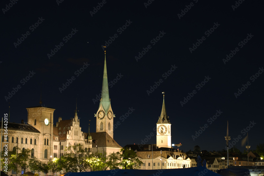 Old town of Zurich at nicht with churches Fraumünster (woman's minster) and Sankt Peter (saint peter). Photo taken May 29th, 2021, Zurich, Switzerland. Old town of Zurich at nicht with churches Fraumünster (woman's minster) and Sankt Peter (saint peter). Photo taken May 29th, 2021, Zurich, Switzerland.