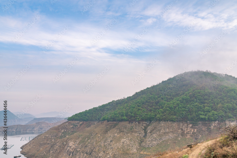 Fototapeta premium Lakes, hills and woods in Dandong, China, in spring.