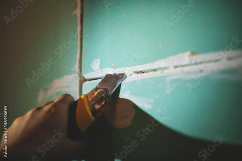 leveling the walls with plasterboard